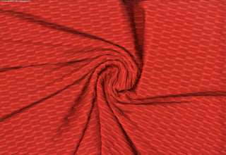 Textured honeycomb knit pattern with dimensional raised geometric shapes for dynamic designs TANGERINE
