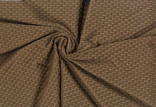 Stretch knit fabric featuring a raised honeycomb pattern with a structured, textured jacquard weave BROWN