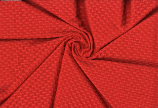Stretch knit fabric featuring a raised honeycomb pattern with a structured, textured jacquard weave TANGERINE