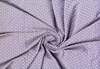 Stretch knit fabric featuring a raised honeycomb pattern with a structured, textured jacquard weave LAVENDER