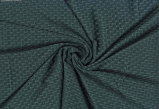 Stretch knit fabric featuring a raised honeycomb pattern with a structured, textured jacquard weave SPRUCE