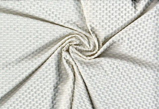 Stretch knit fabric featuring a raised honeycomb pattern with a structured, textured jacquard weave OFF WHITE