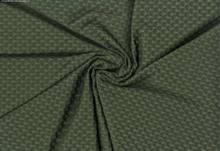 Stretch knit fabric featuring a raised honeycomb pattern with a structured, textured jacquard weave OLIVE