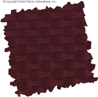 Stretch knit fabric featuring a raised honeycomb pattern with a structured, textured jacquard weave MERLOT