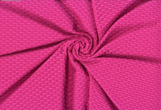 Stretch knit fabric featuring a raised honeycomb pattern with a structured, textured jacquard weave ULTRA PINK
