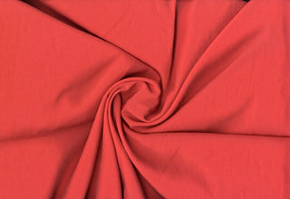 Air Flow Crinkle Seduction: Soft, textured woven polyester fabric by the yard for apparel, décor, and crafts. CORAL