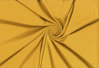 Soft rayon hacci slub stripe knit with lightweight stretch, ideal for shirts, blouses, and crafts. MUSTARD