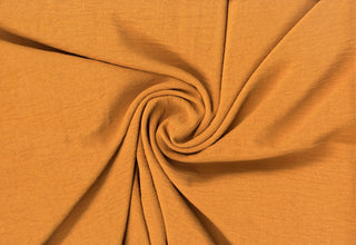 Lightweight woven fabric featuring a soft, textured surface with an airy, flowing, elegant drape COPPER
