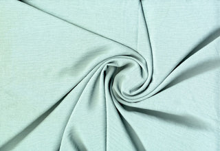 Lightweight woven fabric featuring a soft, textured surface with an airy, flowing, elegant drape ALOE