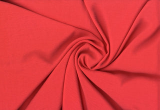 Lightweight woven fabric featuring a soft, textured surface with an airy, flowing, elegant drape CORAL