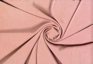 Lightweight woven fabric featuring a soft, textured surface with an airy, flowing, elegant drape PINK