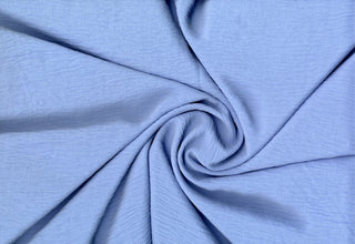 Lightweight woven fabric featuring a soft, textured surface with an airy, flowing, elegant drape BLUE
