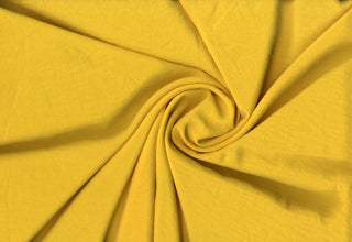 Lightweight woven fabric featuring a soft, textured surface with an airy, flowing, elegant drape YELLOW