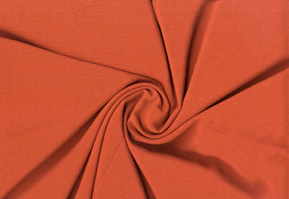 Lightweight woven fabric featuring a soft, textured surface with an airy, flowing, elegant drape RUST