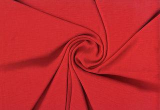 Lightweight woven fabric featuring a soft, textured surface with an airy, flowing, elegant drape RED
