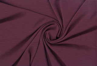 Lightweight woven fabric featuring a soft, textured surface with an airy, flowing, elegant drape EGGPLANT