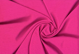 Lightweight woven fabric featuring a soft, textured surface with an airy, flowing, elegant drape ULTRA HOT PINK