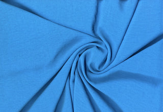 Lightweight woven fabric featuring a soft, textured surface with an airy, flowing, elegant drape ULTRA TURQUOISE