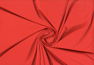 Elastic, airy Jersey knit texture perfect for crafting fitted garments, sportswear, and flowing dresses TANGERINE