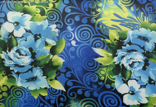 A vibrant floral pattern with large flowers, leaves, and swirling abstract designs in the background. BLACK/GREEN/AQUA