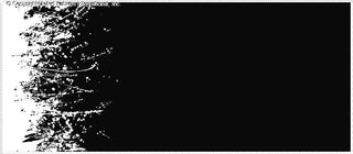 Splattered, abstract design with irregular, scattered shapes resembling paint splashes on a solid background.