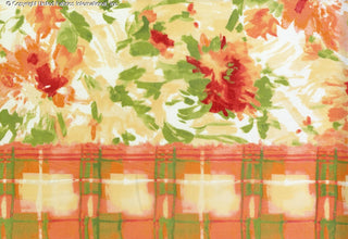 A floral print with scattered flowers and leaves, bordered by a checkered grid on both sides. RED/ORANGE/GRN