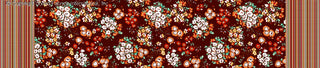 A detailed floral pattern featuring clusters of daisies and small flowers with leaves, set against a background, framed by intricate striped borders on both sides. ORANGE/BLUE/YELLOW