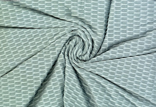 Textured honeycomb knit pattern with dimensional raised geometric shapes for dynamic designs ALOE