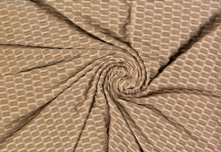 Textured honeycomb knit pattern with dimensional raised geometric shapes for dynamic designs TAUPE