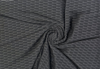Textured honeycomb knit pattern with dimensional raised geometric shapes for dynamic designs CHARCOAL