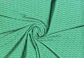 Textured honeycomb knit pattern with dimensional raised geometric shapes for dynamic designs PARIS GREEN