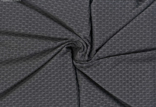 Stretch knit fabric featuring a raised honeycomb pattern with a structured, textured jacquard weave CHARCOAL