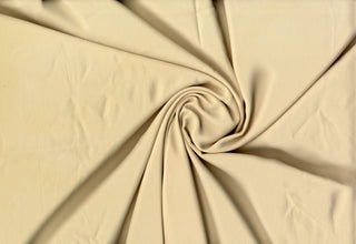 Solid Tribeca crepe fabric, 100% polyester, lightweight, durable, easy to sew—great for clothing and décor projects. TAN