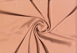 Solid Tribeca crepe fabric, 100% polyester, lightweight, durable, easy to sew—great for clothing and décor projects. MAUVE DK