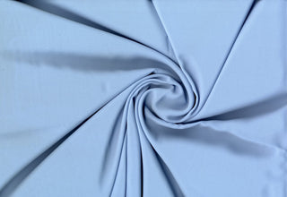 Solid Tribeca crepe fabric, 100% polyester, lightweight, durable, easy to sew—great for clothing and décor projects. SKY