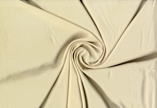 Solid Tribeca crepe fabric, 100% polyester, lightweight, durable, easy to sew—great for clothing and décor projects.