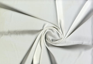 Solid Tribeca crepe fabric, 100% polyester, lightweight, durable, easy to sew—great for clothing and décor projects. OFF WHITE