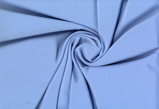 Solid Tribeca crepe fabric, 100% polyester, lightweight, durable, easy to sew—great for clothing and décor projects. CHAMBRAY