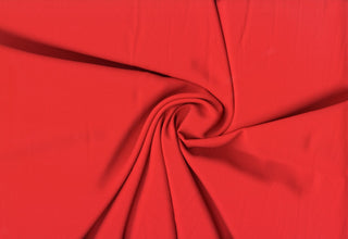 Solid Tribeca crepe fabric, 100% polyester, lightweight, durable, easy to sew—great for clothing and décor projects. RED
