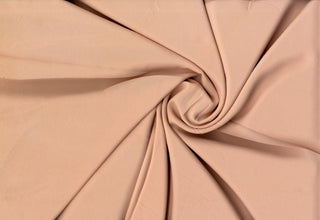 Solid Tribeca crepe fabric, 100% polyester, lightweight, durable, easy to sew—great for clothing and décor projects. FRENCH MAUVE