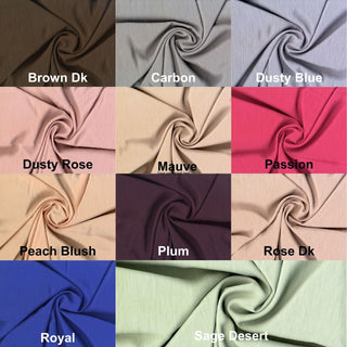 Textured crepe fabric with subtle two-tone weave and fluid drape for dressmaking and décor projects