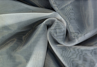Sheer organza fabric with shiny finish, perfect for wedding gowns, crafts, and elegant DIY projects.