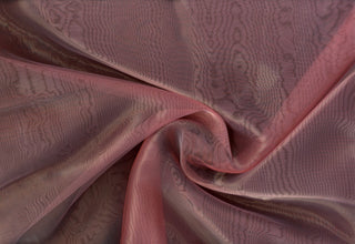 Sheer organza fabric with shiny finish, perfect for wedding gowns, crafts, and elegant DIY projects.