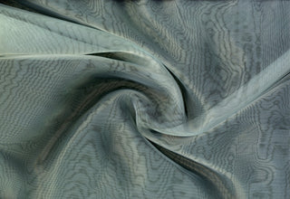 Sheer organza fabric with shiny finish, perfect for wedding gowns, crafts, and elegant DIY projects.
