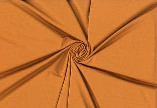 Versa Jersey fabric, 82% polyester, 18% spandex, 4-way stretch, 250 GSM, ideal for activewear and apparel. COPPER