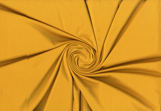 Versa Jersey fabric, 82% polyester, 18% spandex, 4-way stretch, 250 GSM, ideal for activewear and apparel. MUSTARD