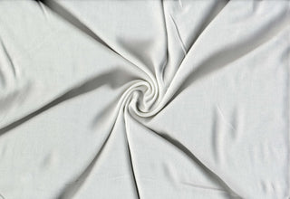 Soft and airy 100% rayon gauze fabric with cheesecloth texture, ideal for flowy apparel and crafts.