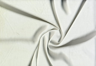 Soft lightweight 100% rayon challis fabric, perfect for breezy tops, dresses, crafts, and home décor. IVORY