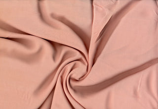 Soft lightweight 100% rayon challis fabric, perfect for breezy tops, dresses, crafts, and home décor. PEACH