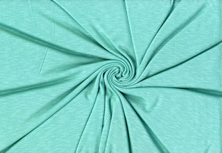Soft stretch slub jersey knit in 100% polyester, ideal for DIY apparel, crafts, and sublimation. MINT